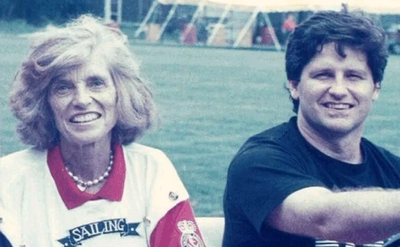 Eunice Kennedy Shriver (founder of Special Olympics) smiling sitting next to Beau (President of SOCT).